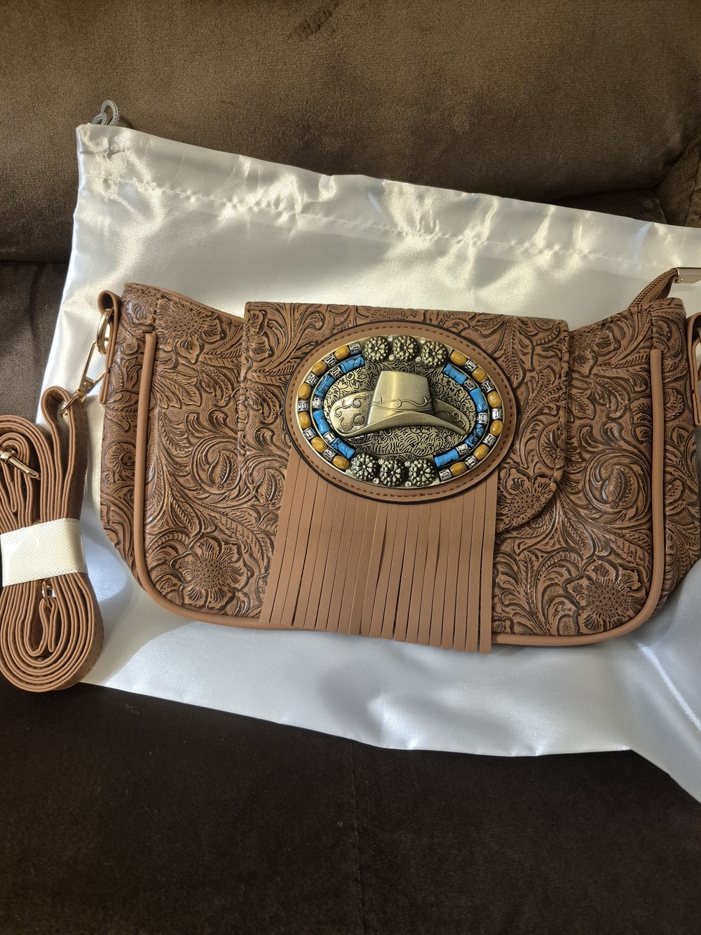 Women’s Tan Crossbody Bag with Tooled Floral Design and Western Concho
